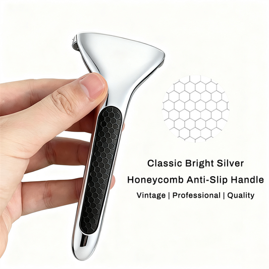 Chrome double edge safety razor with a black honeycomb anti-slip handle, held in one hand